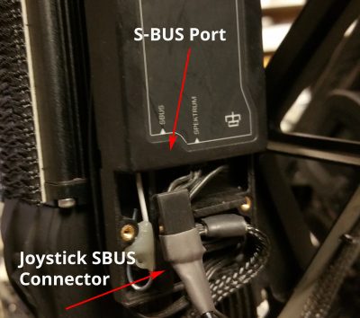 Plug in the Joystick SBUS Connector. Route the joystick wire along with existing wires.